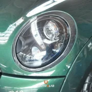 Modanatura fari anteriori in carbonio MINI R55 / R56 / R57 / R58 / R59